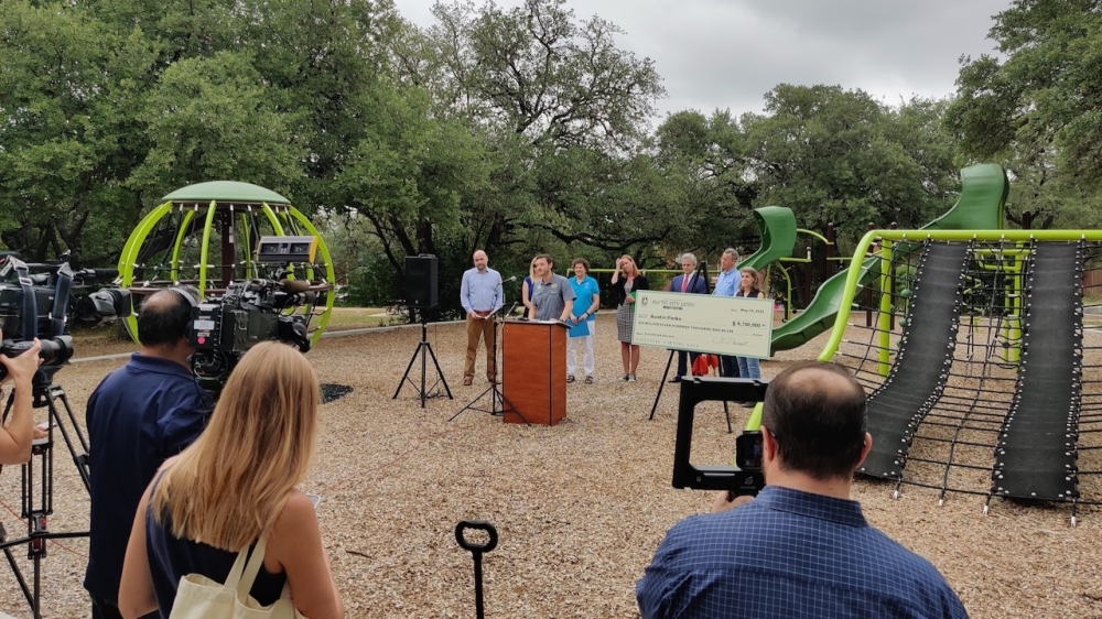 City officials joined representatives from the Austin parks department, Austin Parks Foundation and ACL festival team at Georgian Acres Neighborhood Park to discuss the event's economic output May 10. (Ben Thompson/Community Impact Newspaper)